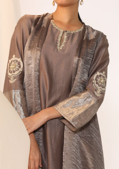 Embroidered silk kurta paired with tissue assymetric cape