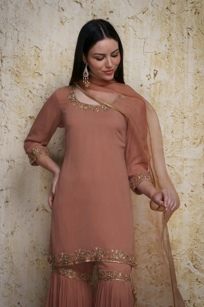 Gulnaz old rose georgette kurta paired with a gharara hand embroidered